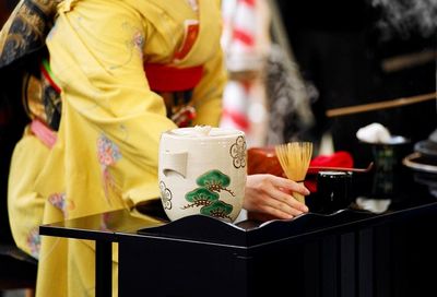 Midsection of man holding food