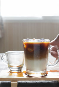 Close-up of coffee in glass on table