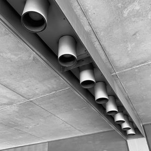 Low angle view of illuminated lamp on wall