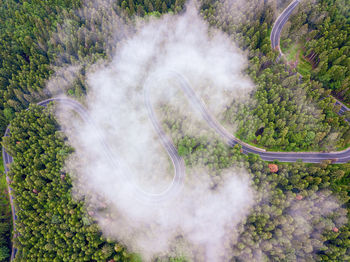 High angle view of man standing amidst smoke