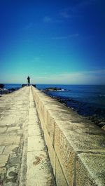 Scenic view of sea against blue sky