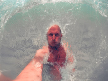 Portrait of man swimming in sea