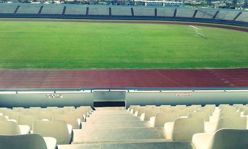 High angle view of empty bleachers at soccer stadium