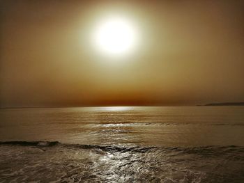 Scenic view of sea against clear sky during sunset