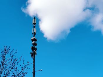 Low angle view of communications tower against sky