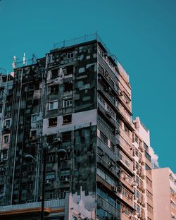 Low angle view of buildings against blue sky