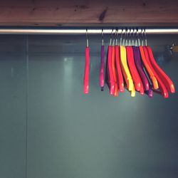 Multi colored coathangers hanging from rack