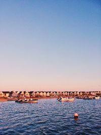 Scenic view of seashore at sunset