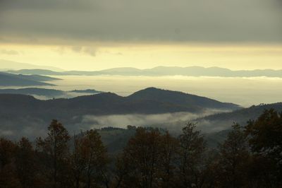 Scenic view of mountains against sky during sunset