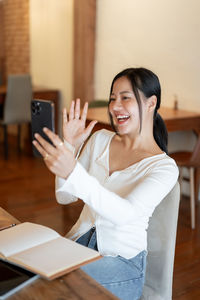 Young woman using mobile phone