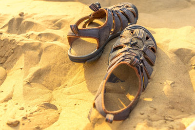 High angle view of shoes on sand