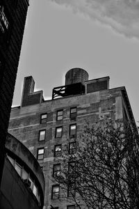 Low angle view of office building against sky