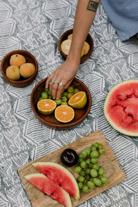 High angle view of woman having fruits