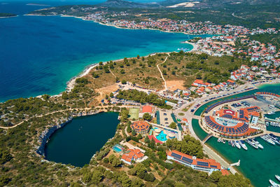 Dragon eye lake near marina frapa in rogoznica, croatia. sea landscape with coastal town and yachts.