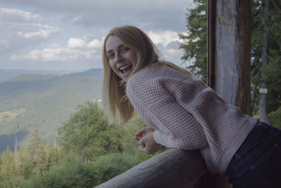 Portrait of laughing woman at observation point