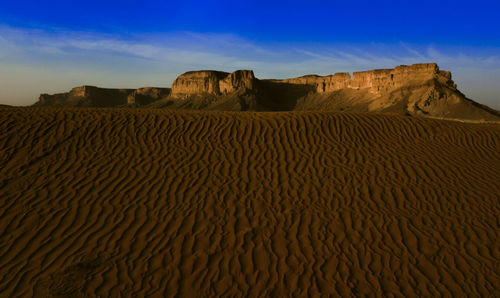 Scenic view of desert against sky