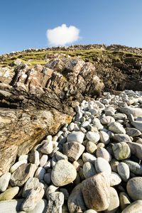 Rocks on landscape against clear sky