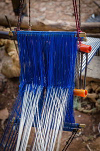 Close-up of strings and woven cloth outdoors, ivory coast, africa