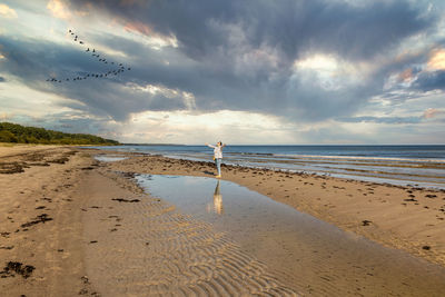 Scenic view of beach against sky