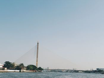 View of bridge over sea against clear sky