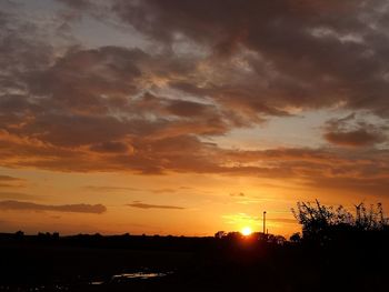 Scenic view of dramatic sky during sunset