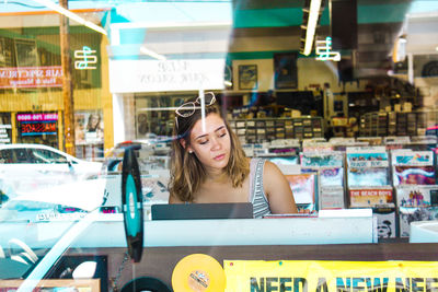 Young woman standing in store