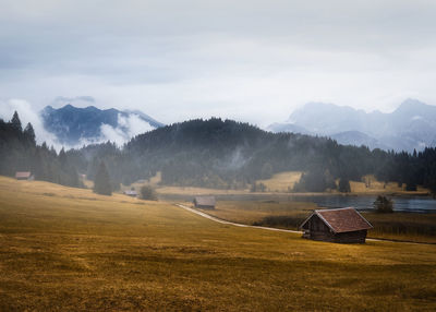 Scenic view of landscape and mountains against sky