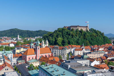 High angle view of townscape against clear blue sky