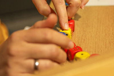 Close-up of baby hand holding toy