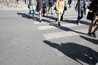 Low section of people crossing road