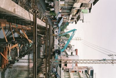 Bridge over canal amidst buildings in city