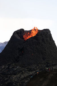 Scenic view of volcanic mountain against sky