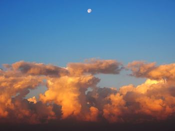 Low angle view of cloudy sky at sunset