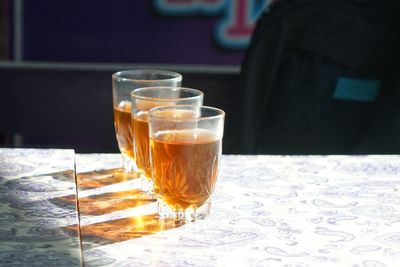 Glass of tea on table