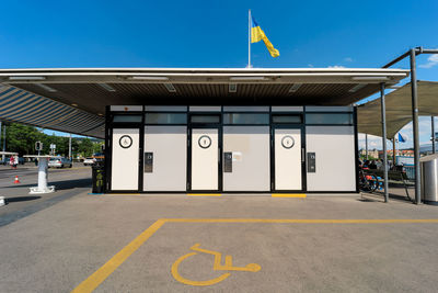 Public wc at pier of lake zurich. outdoor public urinal rooms for men, women and handicapped people.