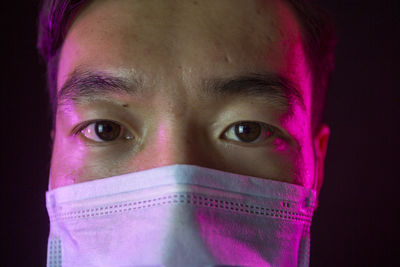 Close-up portrait of a serious young man