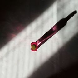 Close-up of red umbrella on table