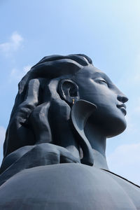 Close-up of statue against blue sky