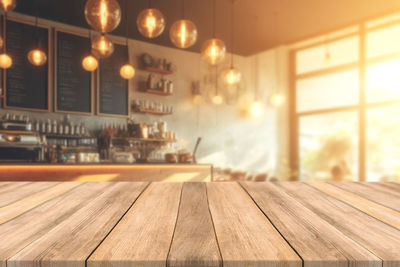 Close-up of wooden table at home