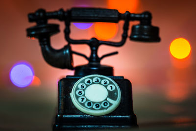 Close-up of telephone on table