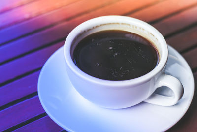 Close-up of coffee cup on table