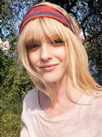 Blonde swedish woman walking in the summer sun.