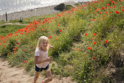 Girl running up a slope