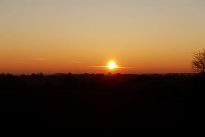 Scenic view of silhouette landscape against sky during sunset