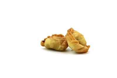 High angle view of bread against white background