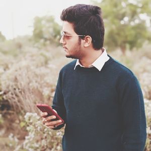 Young man using mobile phone