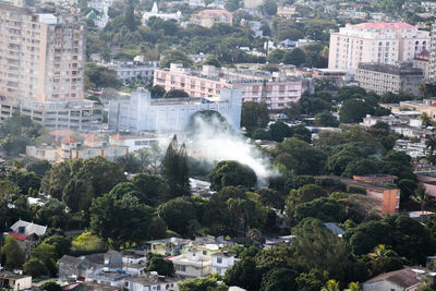 View of cityscape against trees