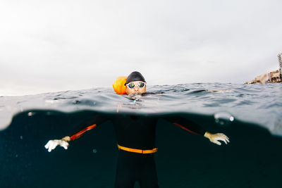 Portrait of man swimming in sea