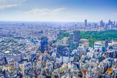 Aerial view of cityscape against sky