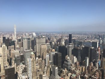 High angle view of modern buildings in city against sky